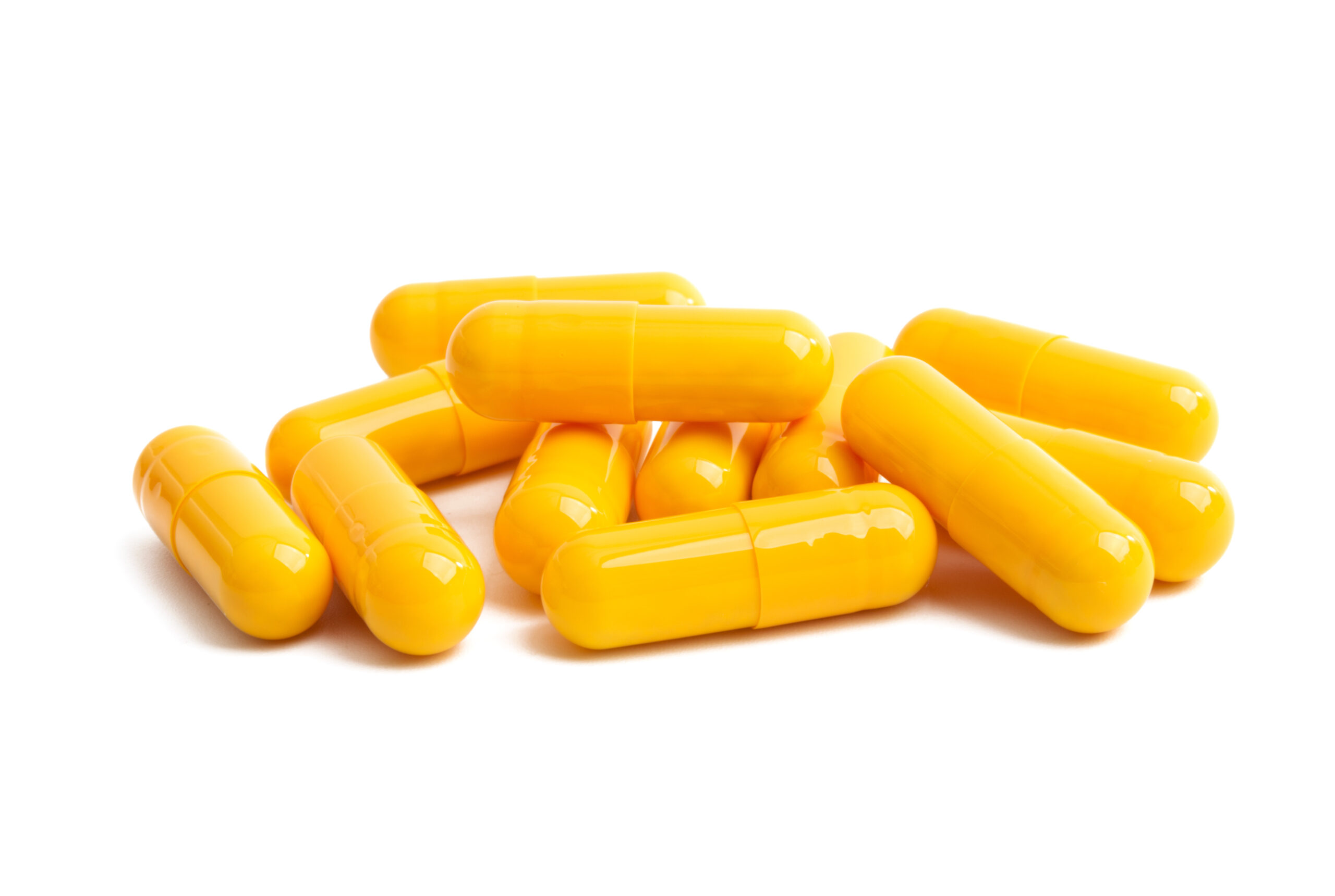 yellow capsules isolated yellow capsules isolated on white background